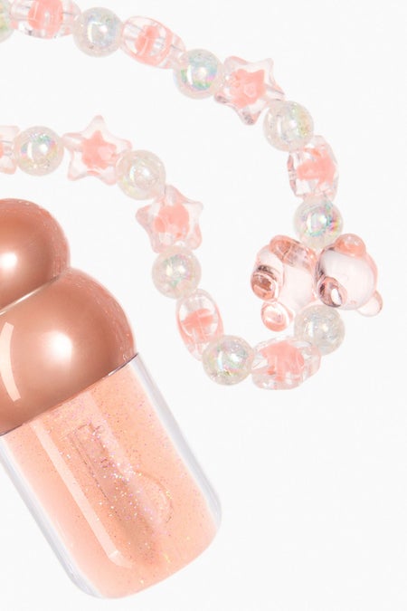 Lip oil charm